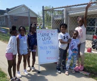 A group of children standing next to each other.